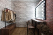 © Sutee - Inside the dressing room in vintage style brick pattern wallpaper wooden table and chairs With a clothes rail, a large mirror and LED lights for makeup and styling.