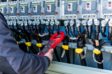 Wall Mural - checking the operating voltage levels of the solar panel switchgear compartment