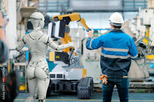 3D Humanoid robot, robot arm and human working automated in factory futuristic modern tech. Future digital technology AI artificial intelligence in industrial factory production line concept.