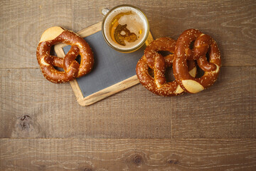 Wall Mural - Oktoberfest concept with beer and pretzel on wooden table