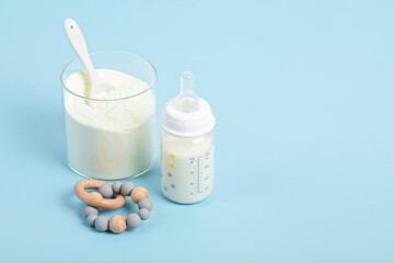 Preparation of formula for baby feeding. Baby health care, organic mixture of dry milk concept.