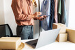 © mojo_cp - Preparing package delivery box Shipping for shopping online. young start up small business owner.