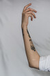 © Gisele Smith - Tattooed arm with white background