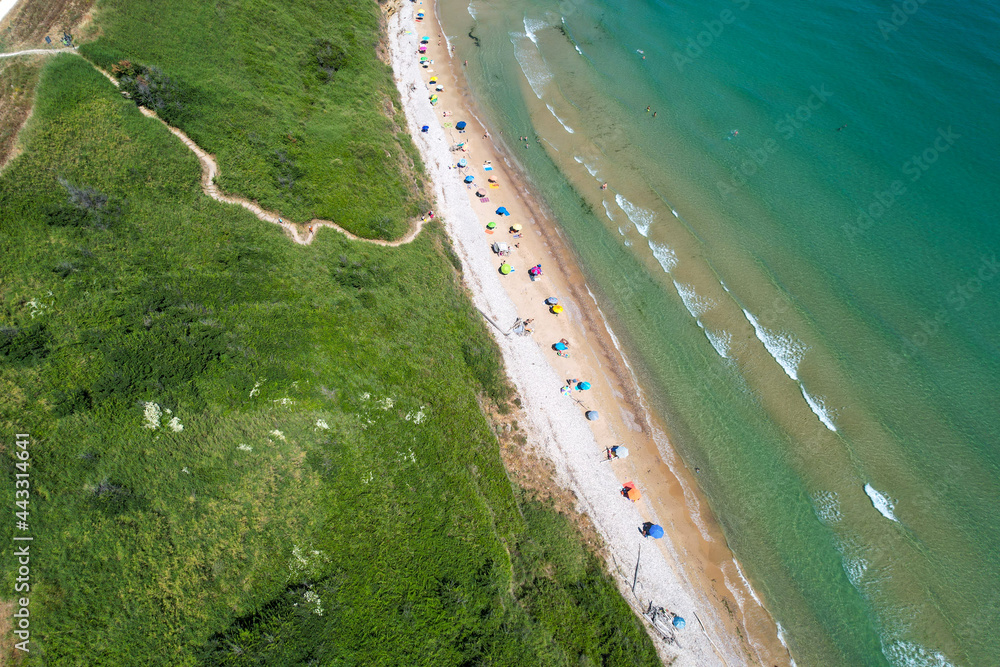 Italian coasts photographed with drone from above. It offers one of the most beautiful stretches of coast in Puglia, Italy with sandy beaches and clifs. Vacation and recreation sites