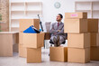 © Elnur - Young male employee in relocation concept