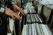 © New Africa - Man choosing vinyl records in store, closeup