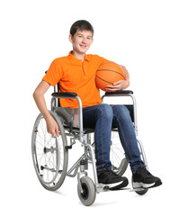 Disabled teenage boy in wheelchair with basketball ball on white background