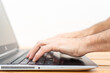© arieldufey - Hands typing on a Laptop with blurred background