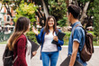 © Marcos - young mexican woman in group of Latin students in university in Latin America