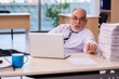 © Elnur - Aged businessman employee unhappy with excessive work