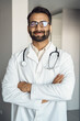 © Stock 4 You - Portrait of indian man doctor medic professional standing with arms crossed