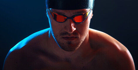 Male swimmer posing. Swimming concept photo.