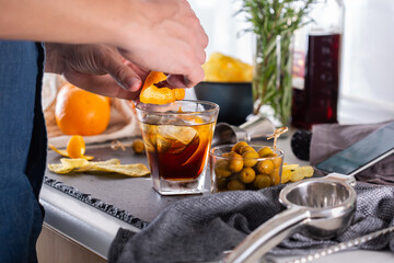 Poster - Mixologist making refreshing cocktail with vermouth at home