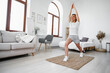 © fotofabrika - Young fitness girl doing sport exercises at her living room at home