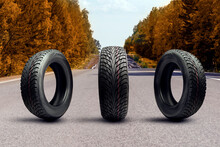 Three Winter Tires On An Autumn Road. Upcoming Seasonal Tire Replacement