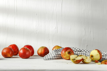 Wall Mural - Fresh apples on white desk and wall with shadows 