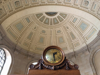 Oppulent stucco ceiling architecture with domes, archways, columns and frescos inside old historic building