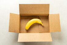Only One Banana In A Brown Paper Box