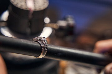 Silver ring with Egyptian pharaoh face on a black stick