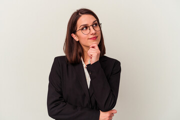 young business woman isolated on white background looking sideways with doubtful and skeptical expre