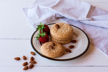 Useful Lenten cookies from almond flour with strawberry on rustic wooden background. selective focus