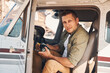 © Svitlana - Handsome young man sitting inside aircraft cockpit