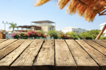 Wooden desk of free space and summer background 