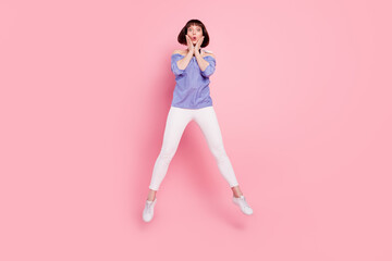 Poster - Full length body size photo woman jumping up amazed touching cheeks isolated pastel pink color background