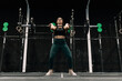 © Manu Reyes - Woman performing a weightlifting exercise inside a gym
