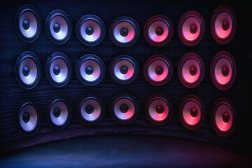 Wall Mural - Group of sound speakers in neon light on black.