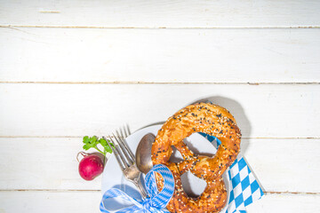 October fest concept. Oktoberfest table setting background, plate fork knife spoon with traditional napkin, beer mug. served at event, bar menu flatlay, white wooden table copy space top view