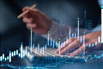 Wall Mural - Hands typing the keyboard to research stock market to proceed right investment solutions. Internet trading and wealth management concept. Formal wear. Hologram Forex chart over close up shot.