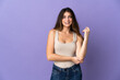 © luismolinero - Young caucasian woman isolated on purple background laughing