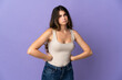 © luismolinero - Young caucasian woman isolated on purple background angry