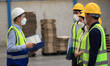 © sittinan - Team workers wear protective face masks for safety industrial factory. worker meeting before start working in factory or warehouse