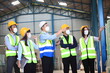 © sittinan - Team workers wear protective face masks for safety industrial factory. worker meeting before start working in factory or warehouse