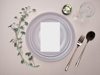 Menu mockup with green foliage. Wedding and Birthday table setting.