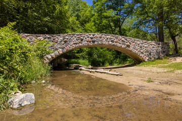 Poster - Stone Arch Footbridge Over A Creek