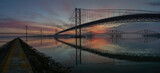 Sunrise over the Forth Bridges from South Queensferry looking towards Fife, Scotland.