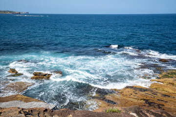 waves crashing on rocks