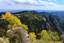 Views Of Granite Peaks, Evergreens, And Changing Aspen Trees In Fall From The Top Of Sandia Peak Tramway In Albuquerque, New Mexico