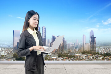 Sticker - Asian Businesswoman standing while using a laptop