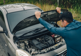 Wall Mural - Serious man headache front of car breakdown and open bonnet on roadside. Car broken concept.