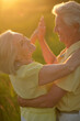 © aletia2011 - Portrait of happy senior woman and man dancing in park