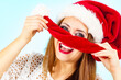 Happy woman in christmas santa hat