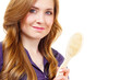 Woman brushing long healthy brown hair