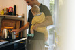 © Jacob Lund - Father with kid making coffee in kitchen