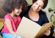 © Rawpixel.com - Mother reading with her daughter