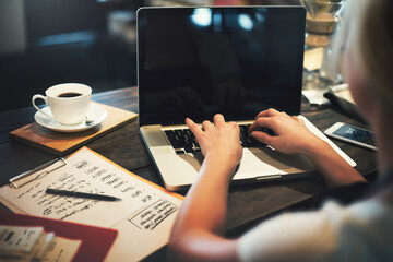 Wall Mural - woman using a laptop with an empty screen