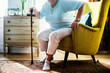 © Rawpixel.com - Senior woman sitting on the chair